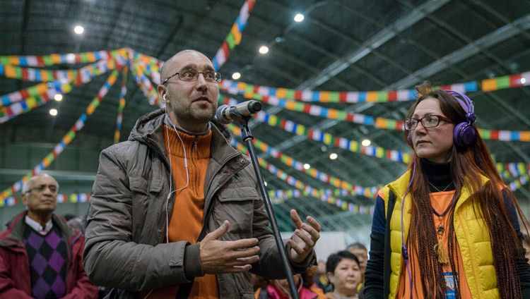 A member of the audience asking His Holiness the Dalai Lama a teaching during the teaching in Riga, Latvia on October 10, 2016. Photo/Tenzin Choejor A member of the audience asking His Holiness the Dalai Lama a teaching during the teaching in Riga, Latvia on October 10, 2016. Photo/Tenzin Choejor