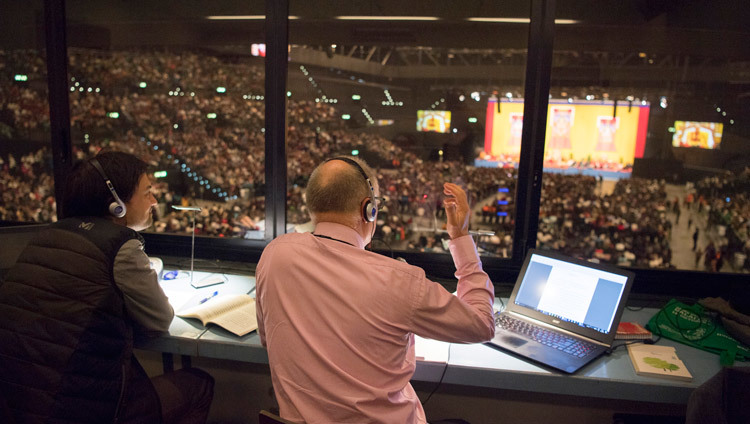 One of several interpreters at His Holiness the Dalai Lama's teaching at the Hallenstadion in Zurich, Switzerland on October 14, 2016. Photo/Manuel Bauer One of several interpreters at His Holiness the Dalai Lama's teaching at the Hallenstadion in Zurich, Switzerland on October 14, 2016. Photo/Manuel Bauer