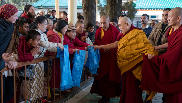 His Holiness the Dalai Lama greeting members of the public on his way to the Main Tibetan Temple on the second day of teachings in Dharamsala, HP, India on March 14, 2017. Photo by Tenzin Choejor/OHHDL His Holiness the Dalai Lama greeting members of the public on his way to the Main Tibetan Temple on the second day of teachings in Dharamsala, HP, India on March 14, 2017. Photo by Tenzin Choejor/OHHDL