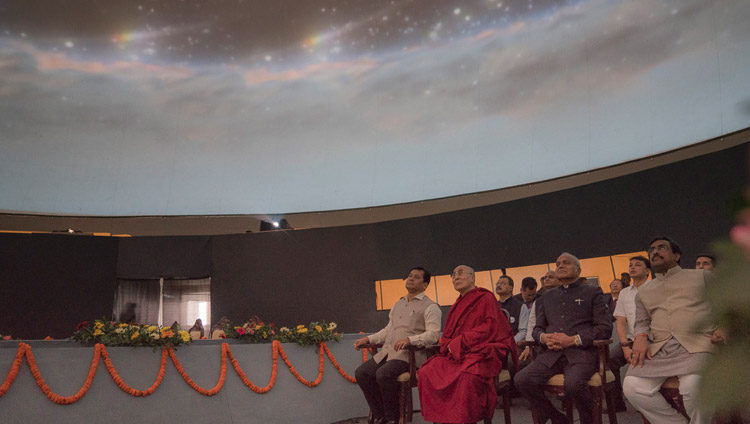 His Holiness the Dalai Lama and special guests watching a video display in a specially fashioned dome at the Namami Brahmaputra Festival in Guwahati, Assam, India on April 2, 2017. Photo by Tenzin Choejor/OHHDL His Holiness the Dalai Lama and special guests watching a video display in a specially fashioned dome at the Namami Brahmaputra Festival in Guwahati, Assam, India on April 2, 2017. Photo by Tenzin Choejor/OHHDL