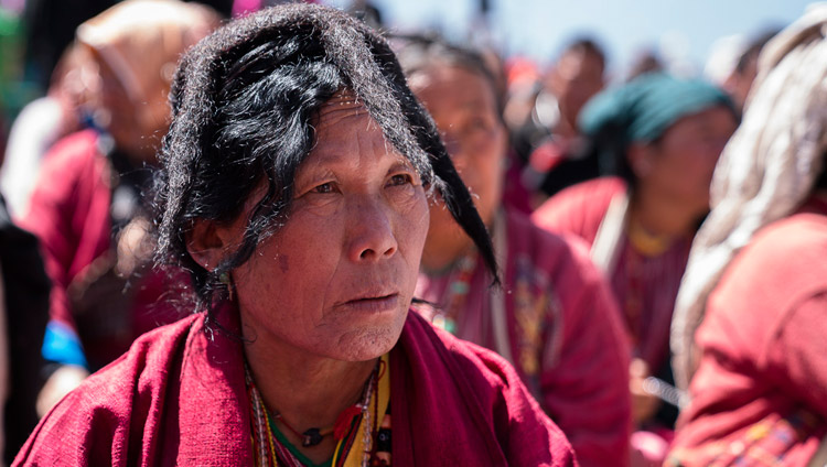 A member of the crowd of over 50,000 listening to His Holiness the Dalai Lama on the final day of his teachings at the Yiga Choezin teaching ground in Tawang, Arunachal Pradesh, India on April 10, 2017. Photo by Tenzin Choejor/OHHDL A member of the crowd of over 50,000 listening to His Holiness the Dalai Lama on the final day of his teachings at the Yiga Choezin teaching ground in Tawang, Arunachal Pradesh, India on April 10, 2017. Photo by Tenzin Choejor/OHHDL