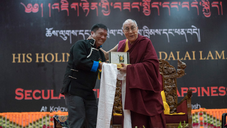 Arunachal Chief Minister Pema Khandu presenting His Holiness the Dalai Lama with a souvenir at the start of his talk at the Kalawangpo Convention Centre in Tawang, Arunachal Pradesh, India on April 10, 2017. Photo by Tenzin Choejor/OHHDL Arunachal Chief Minister Pema Khandu presenting His Holiness the Dalai Lama with a souvenir at the start of his talk at the Kalawangpo Convention Centre in Tawang, Arunachal Pradesh, India on April 10, 2017. Photo by Tenzin Choejor/OHHDL