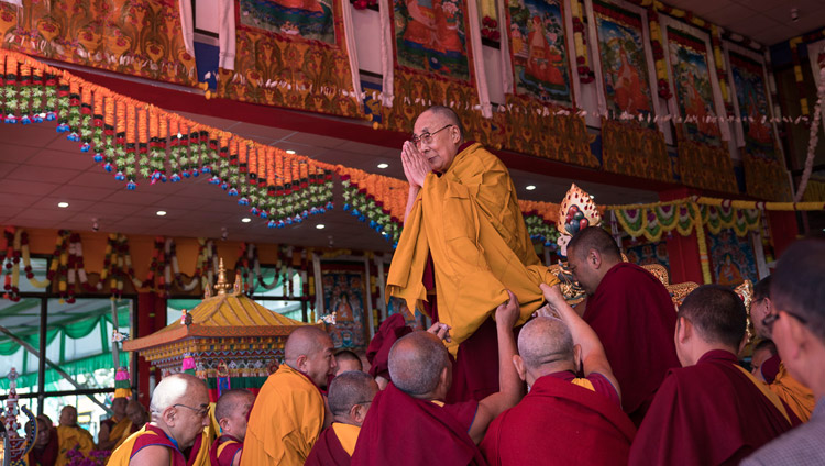 His Holiness the Dalai Lama acknowledging the crowd of over 50,000 gathered to attend the final day of his teachings at the Yiga Choezin teaching ground in Tawang, Arunachal Pradesh, India on April 10, 2017. Photo by Tenzin Choejor/OHHDL His Holiness the Dalai Lama acknowledging the crowd of over 50,000 gathered to attend the final day of his teachings at the Yiga Choezin teaching ground in Tawang, Arunachal Pradesh, India on April 10, 2017. Photo by Tenzin Choejor/OHHDL