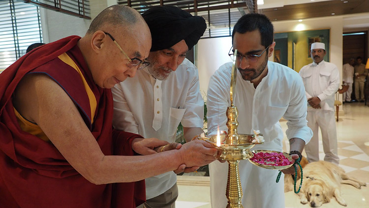 His Holiness the Dalai Lama along with Analjit Singh and his son Vir lighting a lamp to inaugurate the meeting with the Core Committee Working on the Curriculum for Universal Values in New Delhi, India on April 28, 2017. Photo by Jeremy Russell/OHHDL His Holiness the Dalai Lama along with Analjit Singh and his son Vir lighting a lamp to inaugurate the meeting with the Core Committee Working on the Curriculum for Universal Values in New Delhi, India on April 28, 2017. Photo by Jeremy Russell/OHHDL