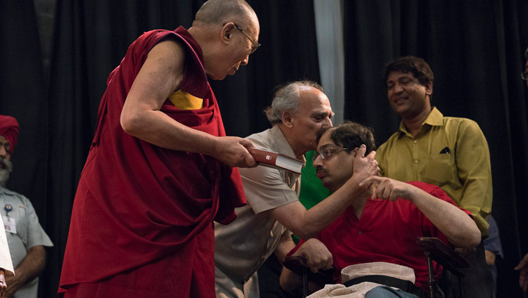 Arun Shourie embracing his son Aditya who had handed His Holiness the Dalai Lama a copy of "Two Saints" to mark the launch of the book at the Indian International Centre in New Delhi, India on May 25, 2017. Photo by Tenzin Choejor/OHHDL Arun Shourie embracing his son Aditya who had handed His Holiness the Dalai Lama a copy of "Two Saints" to mark the launch of the book at the Indian International Centre in New Delhi, India on May 25, 2017. Photo by Tenzin Choejor/OHHDL