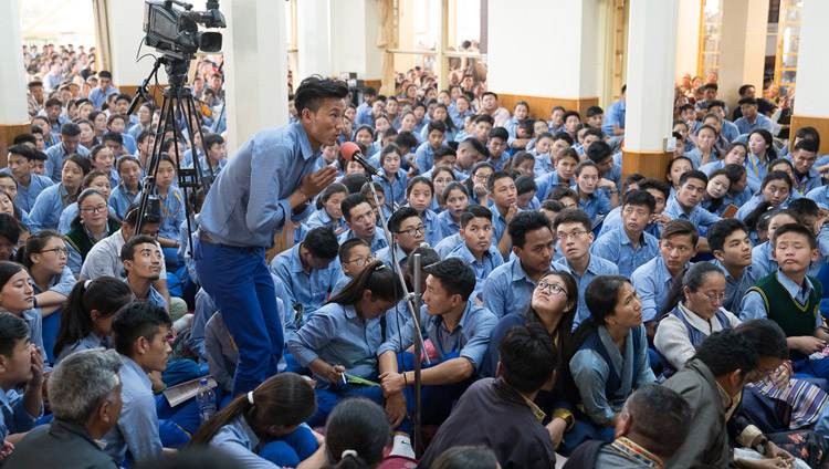 A student asking His Holiness the Dalai Lama a question during the second day of teachings for Tibetan youth at the Main Tibetan Temple in Dharamsala, HP, India on June 6, 2017. Photo by Tenzin Choejor/OHHDL A student asking His Holiness the Dalai Lama a question during the second day of teachings for Tibetan youth at the Main Tibetan Temple in Dharamsala, HP, India on June 6, 2017. Photo by Tenzin Choejor/OHHDL