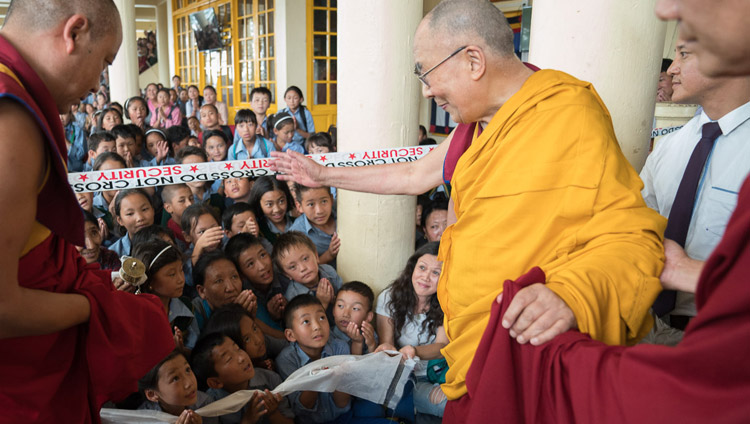 His Holiness the Dalai Lama greeting young Tibetans as he departs the Main Tibetan Temple at the conclusion of the second day of his teaching for Tibetan youth in Dharamsala, HP, India on June 6, 2017. Photo by Tenzin Choejor/OHHDL His Holiness the Dalai Lama greeting young Tibetans as he departs the Main Tibetan Temple at the conclusion of the second day of his teaching for Tibetan youth in Dharamsala, HP, India on June 6, 2017. Photo by Tenzin Choejor/OHHDL