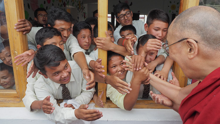 Students reaching out to His Holiness the Dalai Lama as he departs from Ladakh Public School in Leh, Ladakh, J&K, India on July 8, 2017. Photo by Jeremy Russell/OHHDL Students reaching out to His Holiness the Dalai Lama as he departs from Ladakh Public School in Leh, Ladakh, J&K, India on July 8, 2017. Photo by Jeremy Russell/OHHDL
