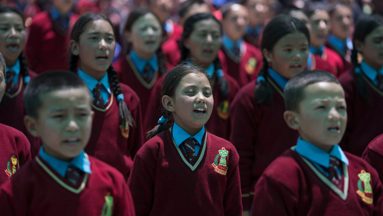 Children from Lamdon School performing the Indian and Tibetan national anthems at the start of the closing ceremony of the Great Summer Debate at the teaching ground in Disket, Nubra Valley, J&K, India on July 10, 2017. Photo by Tenzin Choejor/OHHDL Children from Lamdon School performing the Indian and Tibetan national anthems at the start of the closing ceremony of the Great Summer Debate at the teaching ground in Disket, Nubra Valley, J&K, India on July 10, 2017. Photo by Tenzin Choejor/OHHDL