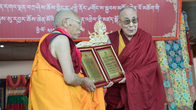 His Holiness the Dalai Lama presenting a certificate of appreciation from the people of Nubra to Ven Thiksey Rinpoche during the closing ceremony of the Great Summer Debate at the teaching ground in Disket, Nubra Valley, J&K, India on July 10, 2017. Photo by Tenzin Choejor/OHHDL His Holiness the Dalai Lama presenting a certificate of appreciation from the people of Nubra to Ven Thiksey Rinpoche during the closing ceremony of the Great Summer Debate at the teaching ground in Disket, Nubra Valley, J&K, India on July 10, 2017. Photo by Tenzin Choejor/OHHDL