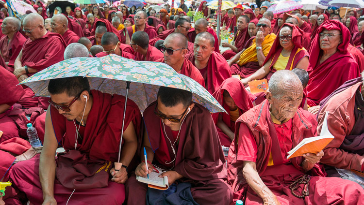 Members of the monastic community following the text during the first day of His Holiness the Dalai Lama's teachings in Disket, Nubra Valley, J&K, India on July 11, 2017. Photo by Tenzin Choejor/OHHDL Members of the monastic community following the text during the first day of His Holiness the Dalai Lama's teachings in Disket, Nubra Valley, J&K, India on July 11, 2017. Photo by Tenzin Choejor/OHHDL