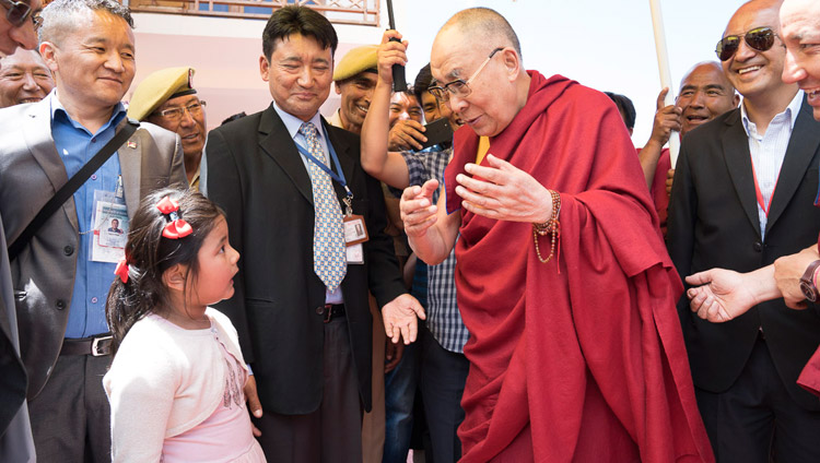His Holiness the Dalai Lama is charmed by a young girl asking serious questions as he departs from Matho Phodrang in Leh, Ladakh, J&K, India on July 20, 2017. Photo by Tenzin Choejor/OHHDL His Holiness the Dalai Lama is charmed by a young girl asking serious questions as he departs from Matho Phodrang in Leh, Ladakh, J&K, India on July 20, 2017. Photo by Tenzin Choejor/OHHDL