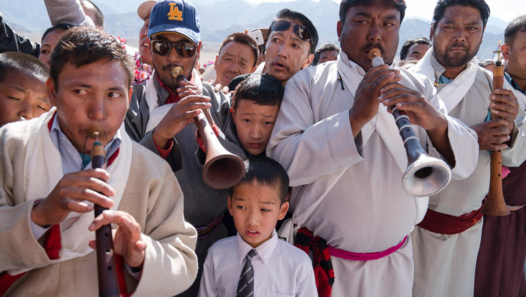 Local residents playing traditional instruments welcoming His Holiness the Dalai Lama as he arrives at Dudjom Nunnery in Shey, Ladakh, J&K, India on July 26, 2017. Photo by Tenzin Choejor/OHHDL Local residents playing traditional instruments welcoming His Holiness the Dalai Lama as he arrives at Dudjom Nunnery in Shey, Ladakh, J&K, India on July 26, 2017. Photo by Tenzin Choejor/OHHDL