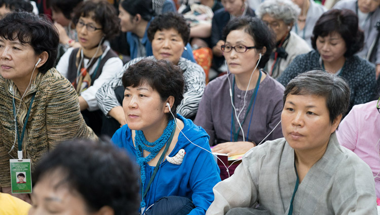 Members of the audienc listening to translations on FM radio during the second day of His Holiness the Dalai Lama's teachings for SE Asians at the Tsuglagkhang in Dharamsala, HP, India on August 30, 2017. PHoto by Ven Lobsang Kunga/OHHDL Members of the audienc listening to translations on FM radio during the second day of His Holiness the Dalai Lama's teachings for SE Asians at the Tsuglagkhang in Dharamsala, HP, India on August 30, 2017. PHoto by Ven Lobsang Kunga/OHHDL