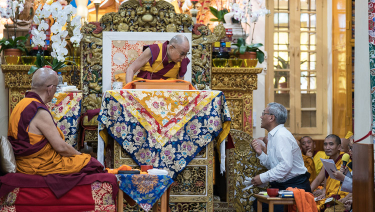 His Holiness the Dalai Lama's English translator reading questions from the audience during the third day of teachings at the Tsuglagkhang in Dharamsala, HP, India on August 31, 2017. Photo by Tenzin Phuntsok/OHHDL His Holiness the Dalai Lama's English translator reading questions from the audience during the third day of teachings at the Tsuglagkhang in Dharamsala, HP, India on August 31, 2017. Photo by Tenzin Phuntsok/OHHDL