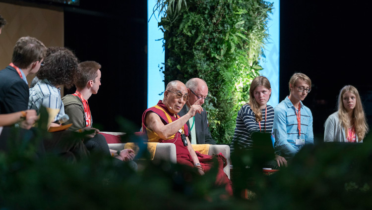 His Holiness the Dalai Lama answering questions from students sitting on stage during their dialogue at the Jahrhunderthalle in Frankfurt, Germany on September 13, 2017. Photo by Tenzin Choejor His Holiness the Dalai Lama answering questions from students sitting on stage during their dialogue at the Jahrhunderthalle in Frankfurt, Germany on September 13, 2017. Photo by Tenzin Choejor