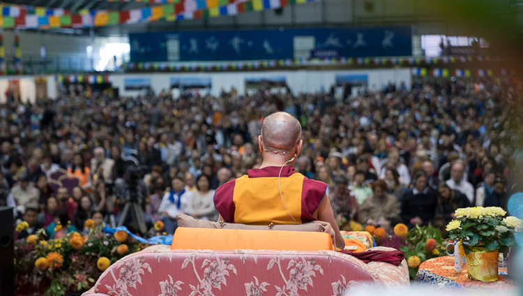 A view from the back of the stage on the second day of His Holiness the Dalai Lama's teachings at Skonto Hall in Riga, Latvia on September 24, 2017. Photo by Tenzin Choejor A view from the back of the stage on the second day of His Holiness the Dalai Lama's teachings at Skonto Hall in Riga, Latvia on September 24, 2017. Photo by Tenzin Choejor