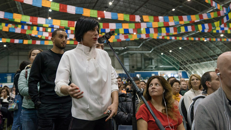 A member of the audience asking His Holiness the Dalai Lama a question during the public dialogue at Skonto Hall in Riga, Latvia on September 25, 2017. Photo by Tenzin Choejor A member of the audience asking His Holiness the Dalai Lama a question during the public dialogue at Skonto Hall in Riga, Latvia on September 25, 2017. Photo by Tenzin Choejor