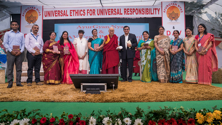 His Holiness the Dalai Lama and representatives from 9 schools releasing the Universal Ethics Curriculum prepared by Ayurgyan Nyas during the program at CJ DAV Public School in Meerut, UP, India on October 16, 2017. Photo by Tenzin Choejor His Holiness the Dalai Lama and representatives from 9 schools releasing the Universal Ethics Curriculum prepared by Ayurgyan Nyas during the program at CJ DAV Public School in Meerut, UP, India on October 16, 2017. Photo by Tenzin Choejor