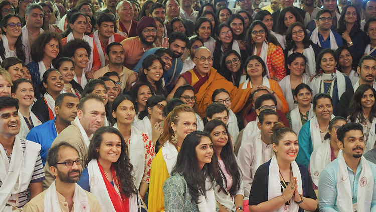 His Holiness the Dalai Lama posing for a group photo with the young people who attended his teaching at Somaiya Vidyavihar Campus Auditorium in Mumbai, India on December 9, 2017. Photo by Jeremy Russell His Holiness the Dalai Lama posing for a group photo with the young people who attended his teaching at Somaiya Vidyavihar Campus Auditorium in Mumbai, India on December 9, 2017. Photo by Jeremy Russell