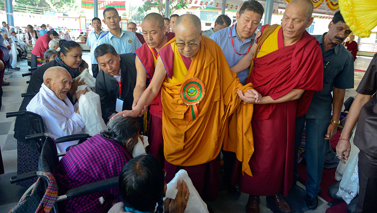 His Holiness the Dalai Lama greeting elderly Tibetans as he arrives at the new debate yard at Jangchub Choeling Nunnery in Mundgod, Karnataka, India on December 15, 2017. Photo by Lobsang Tsering His Holiness the Dalai Lama greeting elderly Tibetans as he arrives at the new debate yard at Jangchub Choeling Nunnery in Mundgod, Karnataka, India on December 15, 2017. Photo by Lobsang Tsering