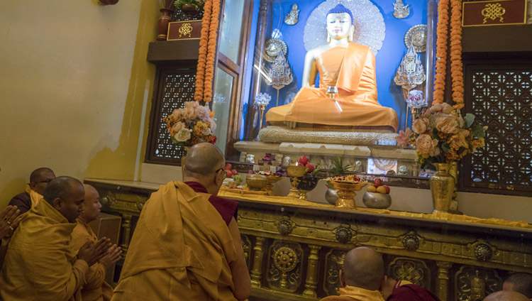 His Holiness the Dalai Lama leading recitations of prayers and praises in front of the Buddha statue inside the Mahabodhi Temple in Bodhgaya, Bihar, India on January 2, 2018. Photo by Tenzin Choejor His Holiness the Dalai Lama leading recitations of prayers and praises in front of the Buddha statue inside the Mahabodhi Temple in Bodhgaya, Bihar, India on January 2, 2018. Photo by Tenzin Choejor