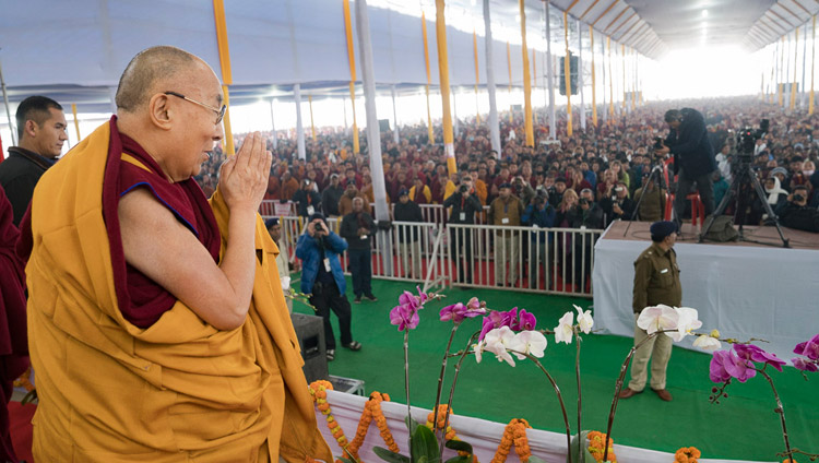 His Holiness the Dalai Lama acknowledging the crowd of over 50,000 on his arrival at the Kalachakra Maidan in Bodhgaya, Bihar, India on January 5, 2018. Photo by Lobsang Tsering His Holiness the Dalai Lama acknowledging the crowd of over 50,000 on his arrival at the Kalachakra Maidan in Bodhgaya, Bihar, India on January 5, 2018. Photo by Lobsang Tsering