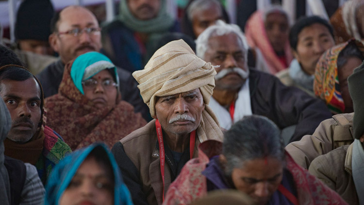 Members of the crowd listening to His Holiness the Dalai Lama on the first day of his teachings requested by Indian Buddhists at the Kalachakra Maidan in Bodhgaya, Bihar, India on January 5, 2018. Photo by Lobsang Tsering Members of the crowd listening to His Holiness the Dalai Lama on the first day of his teachings requested by Indian Buddhists at the Kalachakra Maidan in Bodhgaya, Bihar, India on January 5, 2018. Photo by Lobsang Tsering