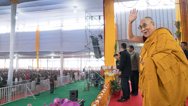 His Holiness the Dalai Lama waving to the crowd on his arrival at the Kalachakra Maidan for the third day of teachings in Bodhgaya, Bihar, India on January 7, 2018. Photo by Lobsang Tsering His Holiness the Dalai Lama waving to the crowd on his arrival at the Kalachakra Maidan for the third day of teachings in Bodhgaya, Bihar, India on January 7, 2018. Photo by Lobsang Tsering