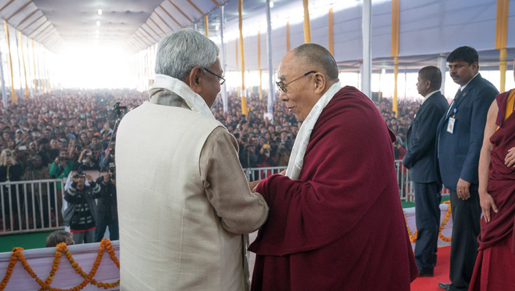 His Holiness the Dalai Lama and Bihar Chief Minister Nitish Kumar exchanging greetings at the start of the book release ceremony in Bodhgaya, Bihar, India on January 7, 2018. Photo by Lobsang Tsering His Holiness the Dalai Lama and Bihar Chief Minister Nitish Kumar exchanging greetings at the start of the book release ceremony in Bodhgaya, Bihar, India on January 7, 2018. Photo by Lobsang Tsering