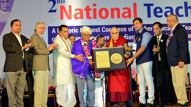 His Holiness the Dalai Lama presenting the Jeevan Gaurav Puraskar Awards at the 2nd National Teachers' Congress Inaugural Ceremony in Pune, Maharashtra, India on January 10, 2018. Photo by Lobsang Tsering His Holiness the Dalai Lama presenting the Jeevan Gaurav Puraskar Awards at the 2nd National Teachers' Congress Inaugural Ceremony in Pune, Maharashtra, India on January 10, 2018. Photo by Lobsang Tsering