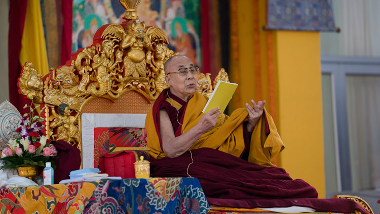 His Holiness the Dalai Lama reading from the text during his teaching at the Kalachakra Maidan in Bodhgaya, Bihar, India on January 14, 2018. Photo by Lobsang Tsering His Holiness the Dalai Lama reading from the text during his teaching at the Kalachakra Maidan in Bodhgaya, Bihar, India on January 14, 2018. Photo by Lobsang Tsering