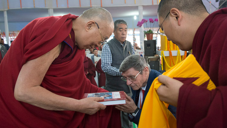 Valentino Giacomin presenting his new book "Universal Ethics" to His Holiness the Dalai Lama at the start of the talk to students organized by his foundation the Alice Project in Bodhgaya, Bihar, India on January 25, 2018. Photo by Lobsang Tsering Valentino Giacomin presenting his new book "Universal Ethics" to His Holiness the Dalai Lama at the start of the talk to students organized by his foundation the Alice Project in Bodhgaya, Bihar, India on January 25, 2018. Photo by Lobsang Tsering