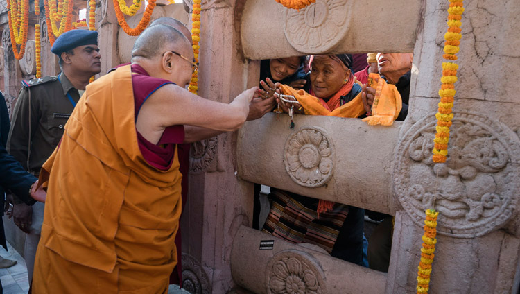 His Holiness the Dalai Lama greeting pilgrims during his visit to the Mahabodhi Stupa in Bodhgaya, Bihar, India on January 28, 2018. Photo by Tenzin Choejor His Holiness the Dalai Lama greeting pilgrims during his visit to the Mahabodhi Stupa in Bodhgaya, Bihar, India on January 28, 2018. Photo by Tenzin Choejor