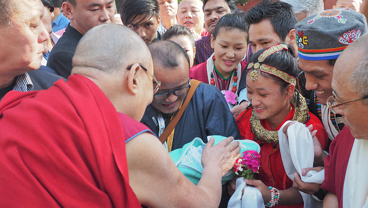 A couple presenting their new born baby to His Holiness the Dalai Lama for a blessing as he arrives at the Central Institute for Higher Tibetan Studies (CIHTS) in Sarnath, UP, India on March 19, 2018. Photo by Jeremy Russell A couple presenting their new born baby to His Holiness the Dalai Lama for a blessing as he arrives at the Central Institute for Higher Tibetan Studies (CIHTS) in Sarnath, UP, India on March 19, 2018. Photo by Jeremy Russell