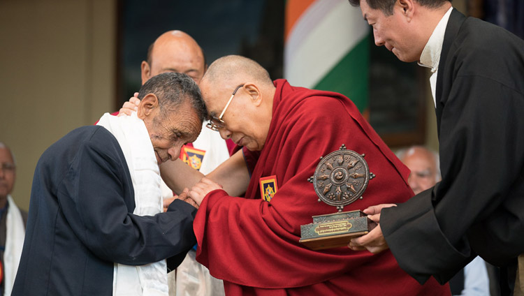 His Holiness the Dalai Lama embracing Naren Chandra Das, the sole known survivor of the seven Assam Rifles personnel who received him at the Indian border in 1959, during the Thank You India celebrations in Dharamsala, HP, India on March 31, 2018. Photo by Tenzin Choejor His Holiness the Dalai Lama embracing Naren Chandra Das, the sole known survivor of the seven Assam Rifles personnel who received him at the Indian border in 1959, during the Thank You India celebrations in Dharamsala, HP, India on March 31, 2018. Photo by Tenzin Choejor