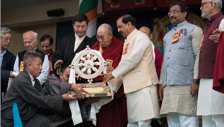 His Holiness the Dalai Lama presenting the Thank You India memento to Chief Guest Union Minister of State for Culture Mahesh Sharma at the Main Tibetan Temple in Dharamsala, HP, India on March 31, 2018. Photo by Tenzin Choejor His Holiness the Dalai Lama presenting the Thank You India memento to Chief Guest Union Minister of State for Culture Mahesh Sharma at the Main Tibetan Temple in Dharamsala, HP, India on March 31, 2018. Photo by Tenzin Choejor