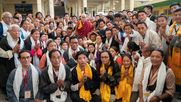 His Holiness the Dalai Lama posing for one of several group photos with Tibetans participating in an International Conference on the Middle Way Approach during their meeting at the Main Tibetan Temple courtyard in Dharamsala, HP, India on May 30, 2018. Photo by Tenzin Choejor His Holiness the Dalai Lama posing for one of several group photos with Tibetans participating in an International Conference on the Middle Way Approach during their meeting at the Main Tibetan Temple courtyard in Dharamsala, HP, India on May 30, 2018. Photo by Tenzin Choejor