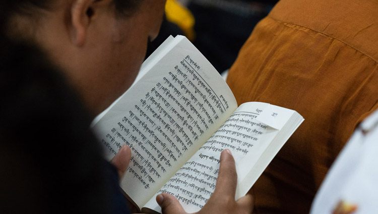 A member of the audience following His Holiness the Dalai Lama's teaching on ‘Guide to the Bodhisattva’s Way of Life’ at the Main Tibetan Temple in Dharamsala, HP, India on June 6, 2018. Photo by Tenzin Phuntsok A member of the audience following His Holiness the Dalai Lama's teaching on ‘Guide to the Bodhisattva’s Way of Life’ at the Main Tibetan Temple in Dharamsala, HP, India on June 6, 2018. Photo by Tenzin Phuntsok