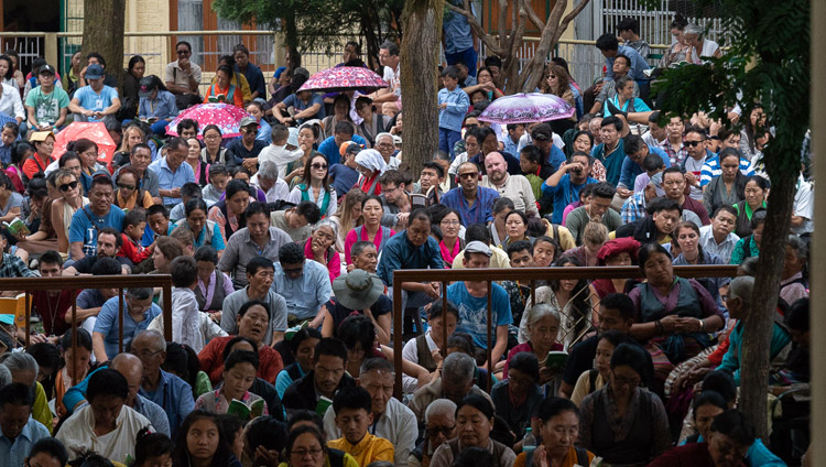 Some of the more than 9000 people attending His Holiness the Dalai Lama's teaching for young Tibetan students sitting in the Main Tibetan Temple courtyard in Dharamsala, HP, India on June 7, 2018. Photo by Tenzin Phuntsok Some of the more than 9000 people attending His Holiness the Dalai Lama's teaching for young Tibetan students sitting in the Main Tibetan Temple courtyard in Dharamsala, HP, India on June 7, 2018. Photo by Tenzin Phuntsok