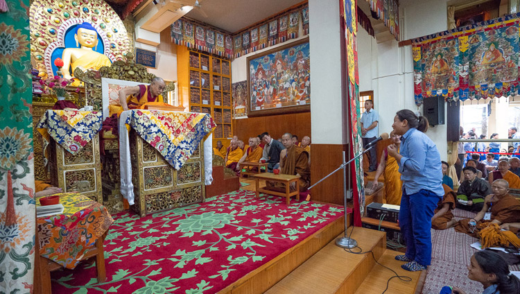 A student asking His Holiness the Dalai Lama a question during a break on the second day of teachings for young Tibetan students at the Main Tibetan Temple in Dharamsala, HP, India on June 7, 2018. Photo by Tenzin Phuntsok A student asking His Holiness the Dalai Lama a question during a break on the second day of teachings for young Tibetan students at the Main Tibetan Temple in Dharamsala, HP, India on June 7, 2018. Photo by Tenzin Phuntsok