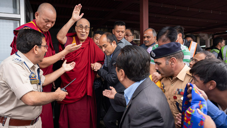 His Holiness the Dalai Lama waving to well-wishers on his arrival at the airport in Leh, Ladakh, J&K, India on July 3, 2018. Photo by Tenzin Choejor His Holiness the Dalai Lama waving to well-wishers on his arrival at the airport in Leh, Ladakh, J&K, India on July 3, 2018. Photo by Tenzin Choejor