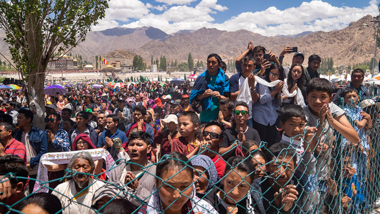 Members of the crowd line the road hoping to catch a glimpse of His Holiness the Dalai Lama as he returns to his residence at the conclusion of celebrations on his 83rd birthday in Leh, Ladakh, J&K, India on July 6, 2018. Photo by Tenzin Choejor Members of the crowd line the road hoping to catch a glimpse of His Holiness the Dalai Lama as he returns to his residence at the conclusion of celebrations on his 83rd birthday in Leh, Ladakh, J&K, India on July 6, 2018. Photo by Tenzin Choejor