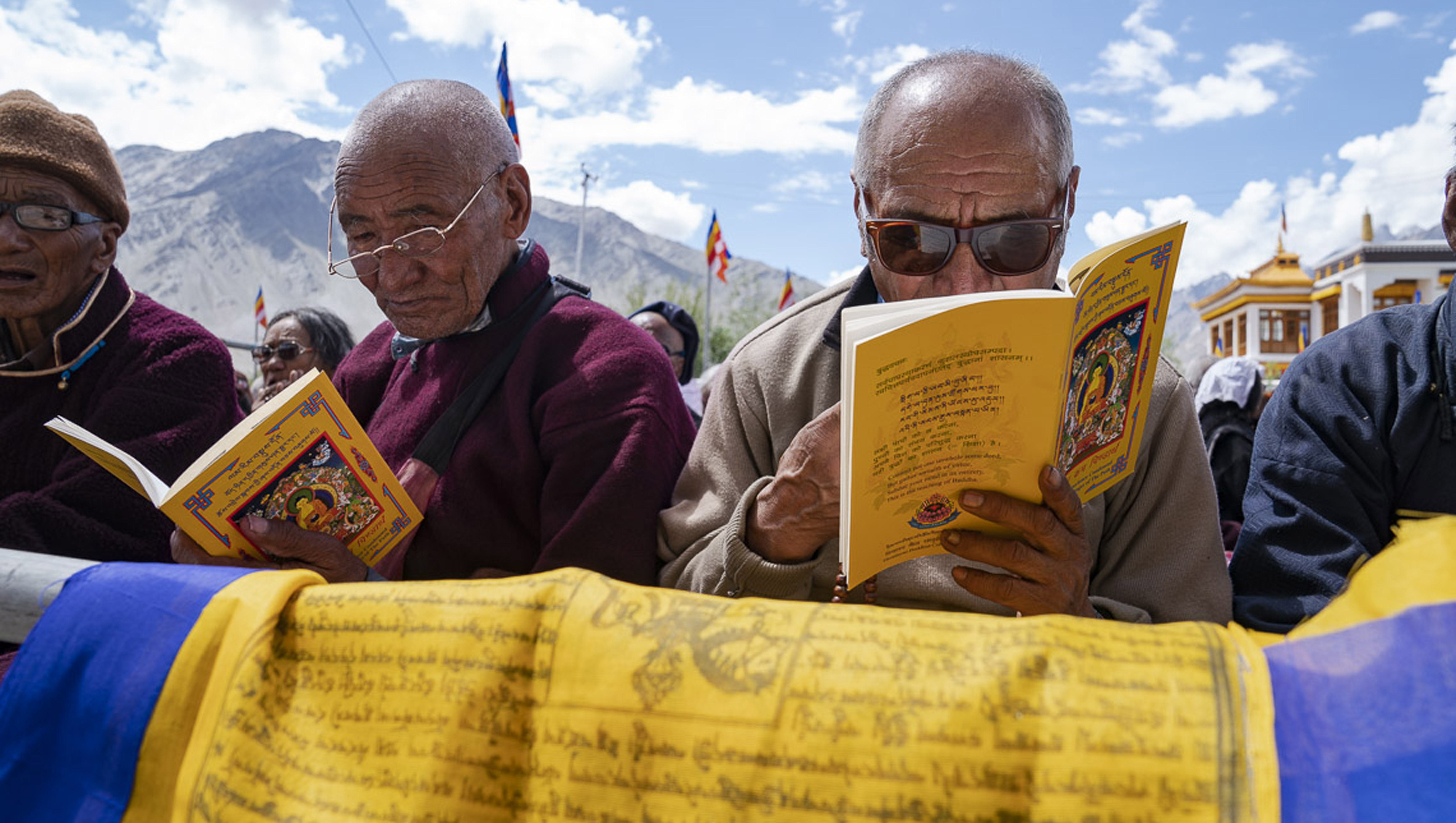 Members of the audience following the text during His Holiness the Dalai Lama's teaching in Padum, Zanskar, J&K, India on July 22, 2018. Photo by Tenzin Choejor Members of the audience following the text during His Holiness the Dalai Lama's teaching in Padum, Zanskar, J&K, India on July 22, 2018. Photo by Tenzin Choejor