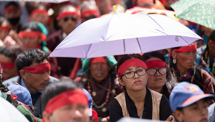 Some members of the audience using umbrellas to protect against the sun during the Avalokiteshvara empowerment given by His Holiness the Dalai Lama in Padum, Zanskar, J&K, India on July 23, 2018. Photo by Tenzin Choejor Some members of the audience using umbrellas to protect against the sun during the Avalokiteshvara empowerment given by His Holiness the Dalai Lama in Padum, Zanskar, J&K, India on July 23, 2018. Photo by Tenzin Choejor