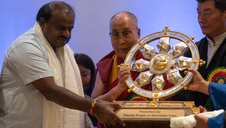 His Holiness the Dalai Lama presenting a Dharma Wheel to Karnataka Chief Minister, HD Kumaraswamy in gratitude to the Karnatakan public during the Thank You Karnataka program in Bengaluru, Karnataka, India on August 10, 2018. Photo by Tenzin Choejor His Holiness the Dalai Lama presenting a Dharma Wheel to Karnataka Chief Minister, HD Kumaraswamy in gratitude to the Karnatakan public during the Thank You Karnataka program in Bengaluru, Karnataka, India on August 10, 2018. Photo by Tenzin Choejor