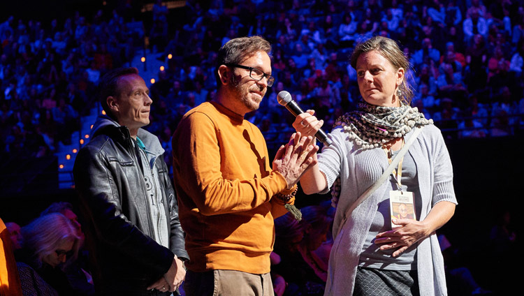 A member of the audience asking His Holiness the Dalai Lama a question during his talk at the Ahoy convention centre in Rotterdam, Netherlands on September 16, 2018. Photo by Olivier Adams A member of the audience asking His Holiness the Dalai Lama a question during his talk at the Ahoy convention centre in Rotterdam, Netherlands on September 16, 2018. Photo by Olivier Adams