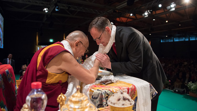 His Holiness the Dalai Lama thanking Mario Fehr, Member of the Council of the Canton of Zurich and a long time friend of Tibet for his speech at Tibet Institute Rikon's 50th Anniversary Celebration in Winterthur, Switzerland on September 22, 2018. Photo by Manuel Bauer His Holiness the Dalai Lama thanking Mario Fehr, Member of the Council of the Canton of Zurich and a long time friend of Tibet for his speech at Tibet Institute Rikon's 50th Anniversary Celebration in Winterthur, Switzerland on September 22, 2018. Photo by Manuel Bauer