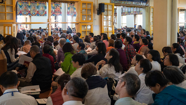 Members of the audience following the text on the final day of His Holiness the Dalai Lama's teaching at the Main Tibetan Temple in Dharamsala, HP, India on October 6, 2018. Photo by Ven Tenzin Jamphel Members of the audience following the text on the final day of His Holiness the Dalai Lama's teaching at the Main Tibetan Temple in Dharamsala, HP, India on October 6, 2018. Photo by Ven Tenzin Jamphel