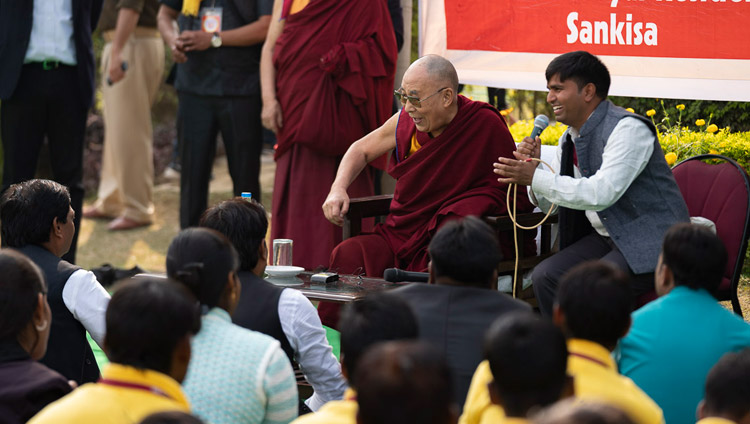 His Holiness the Dalai Lama interacting with volunteers of the Youth Buddhist Society on the lawn of his hotel in Sankisa, UP, India on December 2, 2018. Photo by Tenzin Choejor His Holiness the Dalai Lama interacting with volunteers of the Youth Buddhist Society on the lawn of his hotel in Sankisa, UP, India on December 2, 2018. Photo by Tenzin Choejor